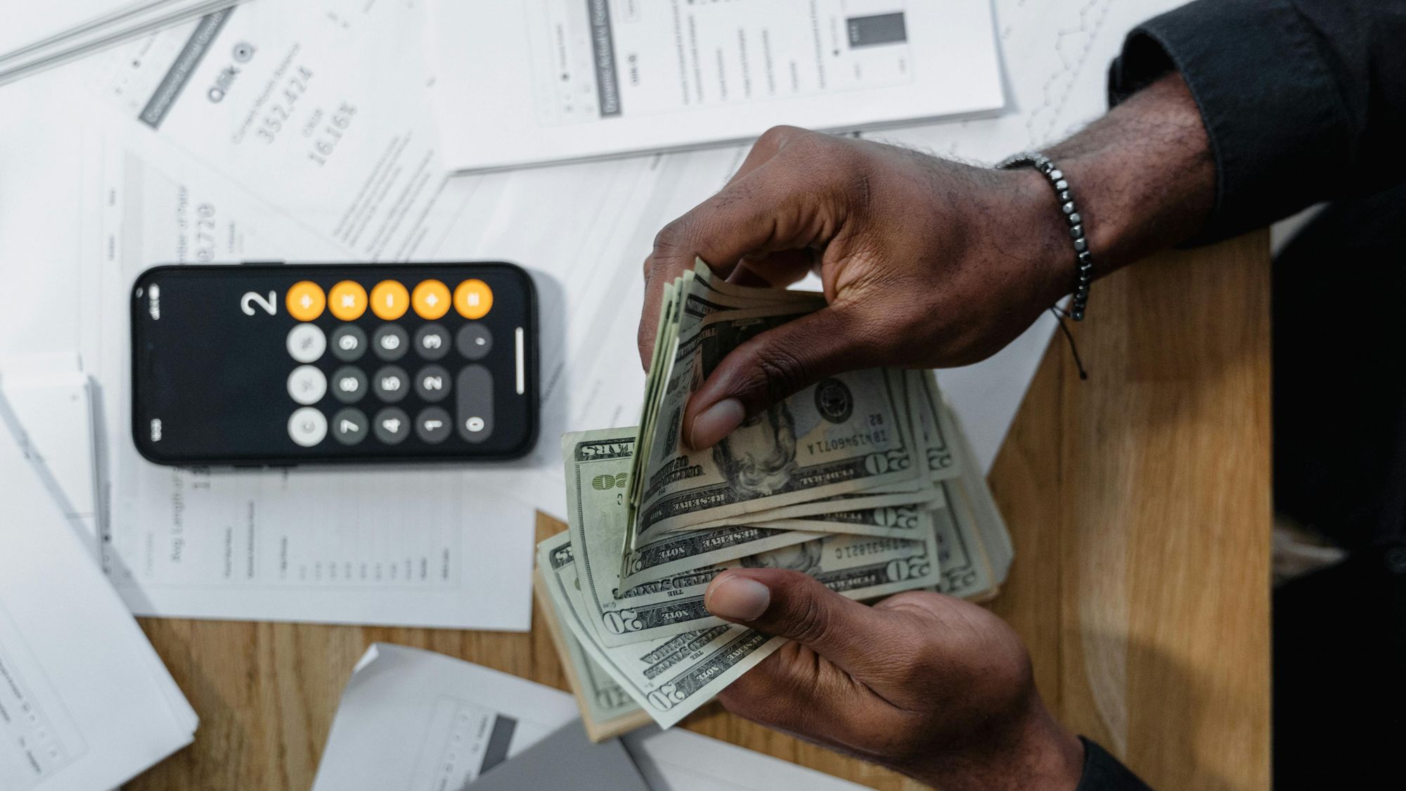 A Certified Public Accountant is counting dollar bills